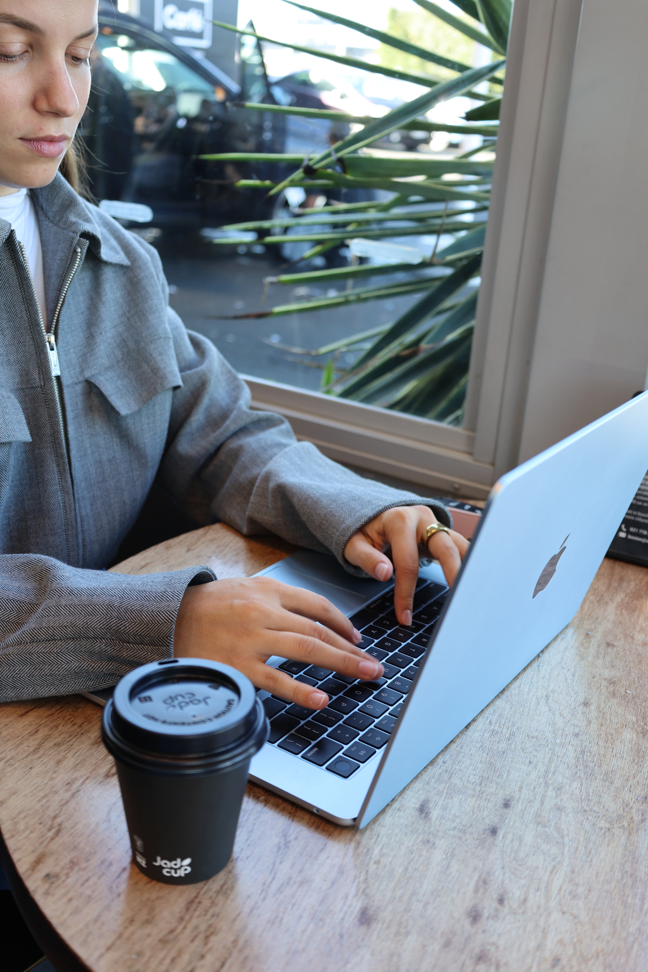 Customer working on a laptop in the Carfē lounge